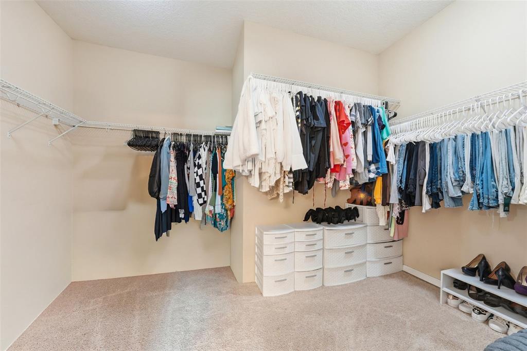 979 Counts Crest Circle Apopka, FL 32712 - Photo 29 of 48 a view of walk in closet with clothes