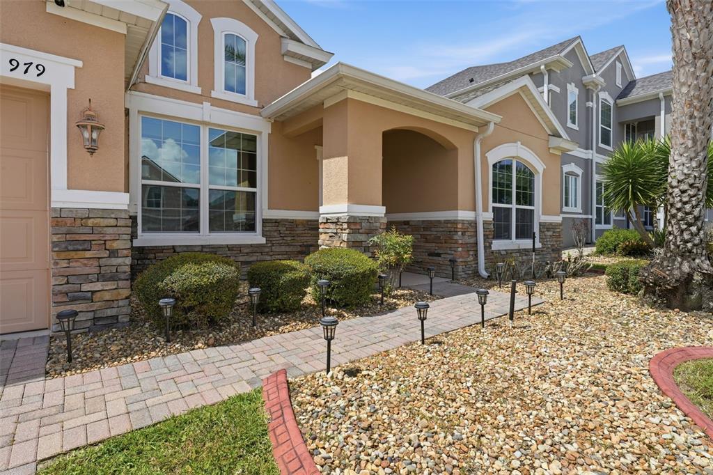 979 Counts Crest Circle Apopka, FL 32712 - Photo 37 of 48 a front view of a house with garden