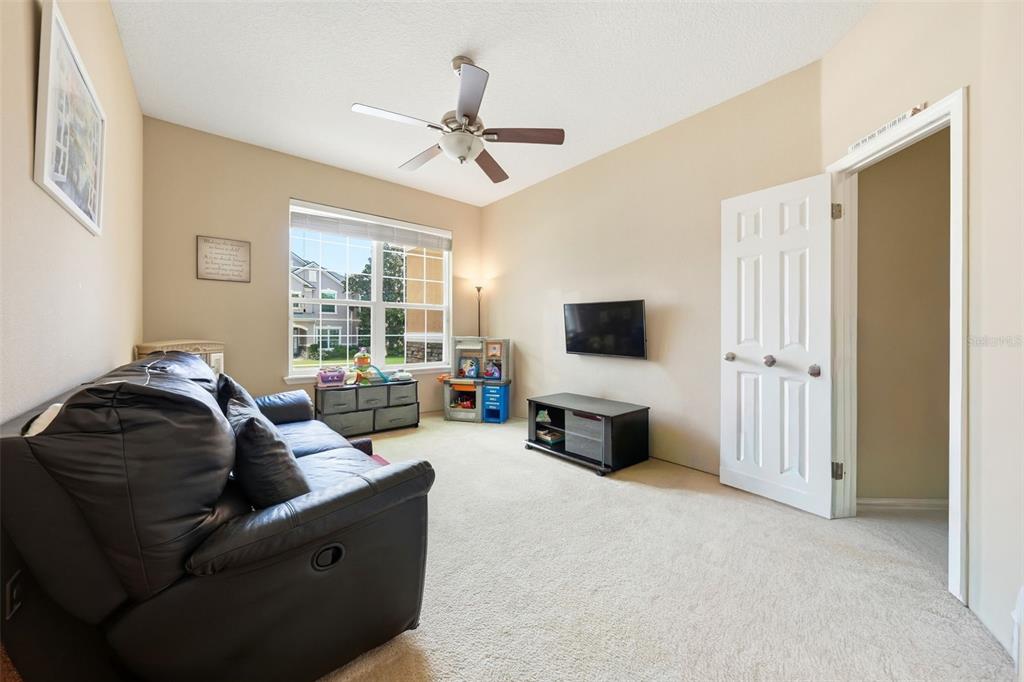979 Counts Crest Circle Apopka, FL 32712 - Photo 38 of 48 a living room with furniture and a flat screen tv