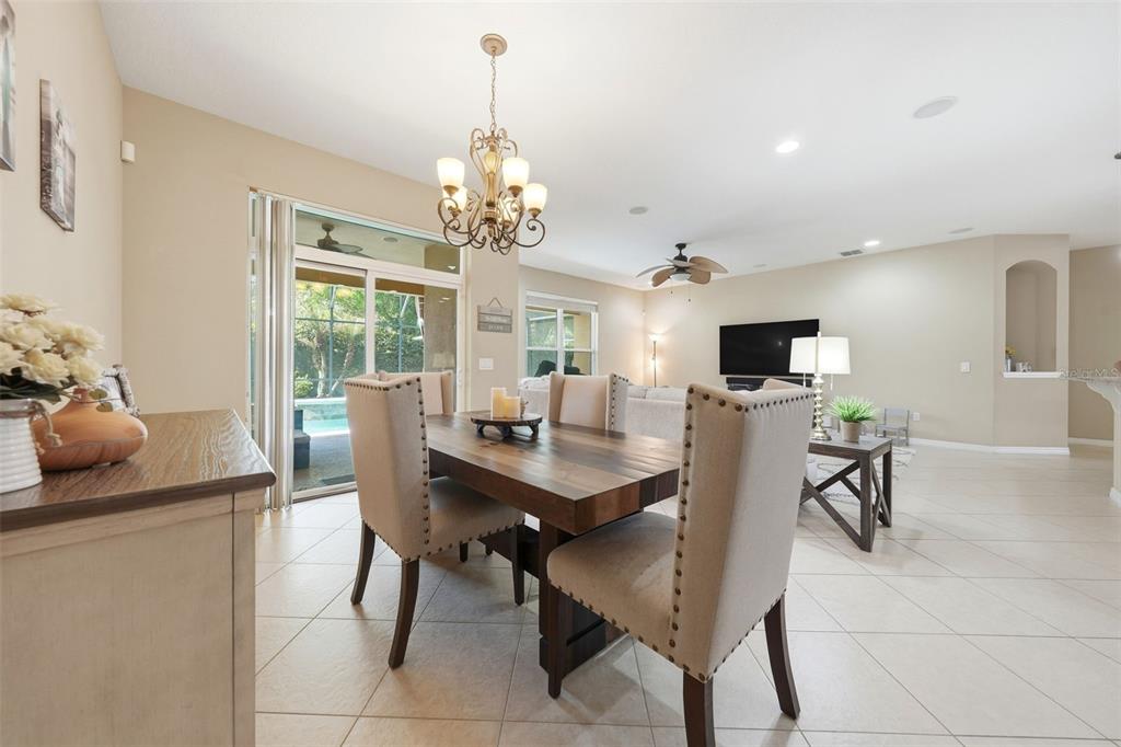 979 Counts Crest Circle Apopka, FL 32712 - Photo 41 of 48 a view of a dining room with furniture and chandelier