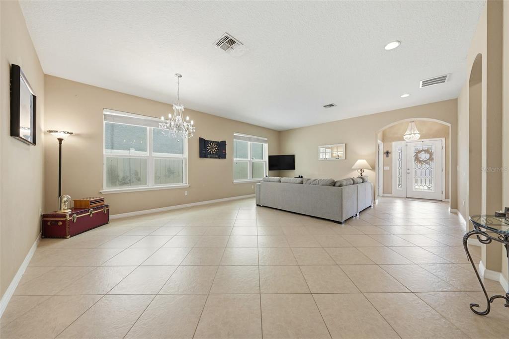 979 Counts Crest Circle Apopka, FL 32712 - Photo 10 of 48 a living room with a furniture and a flat screen tv