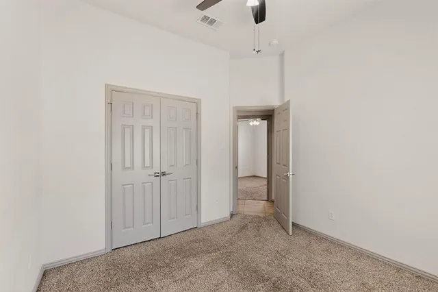 an empty room with fan