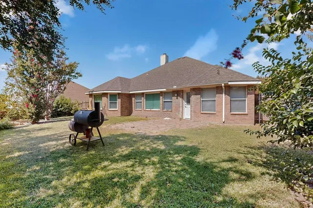 a house view with a garden space