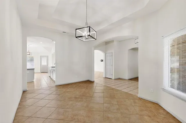 a view of a livingroom with a chandelier and living room