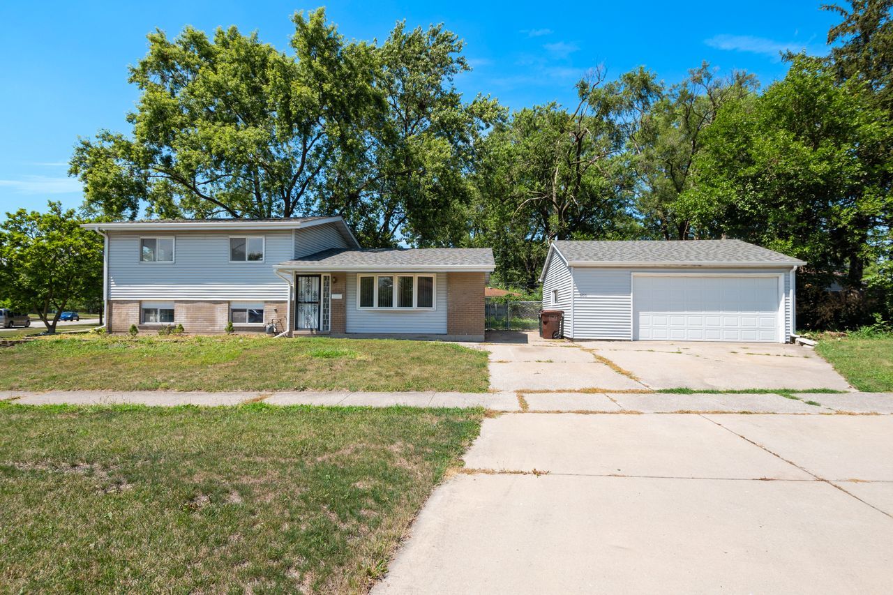 300 Indiana Street Park Forest, IL 60466 - Photo 1 of 26 a house view with a garden space