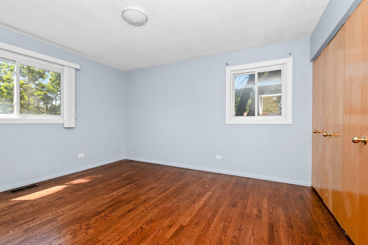 300 Indiana Street Park Forest, IL 60466 - Photo 17 of 26 a view of empty room with wooden floor and fan