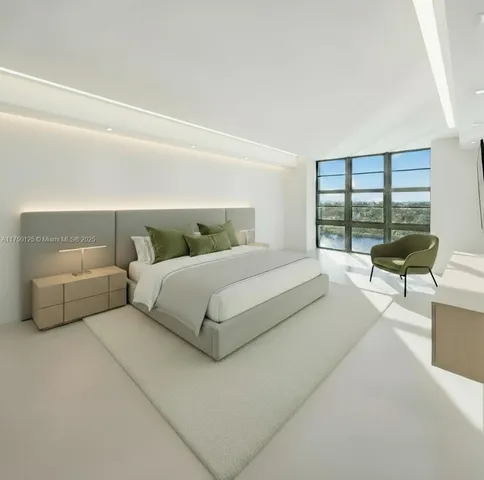 a bedroom with a bed and a large window