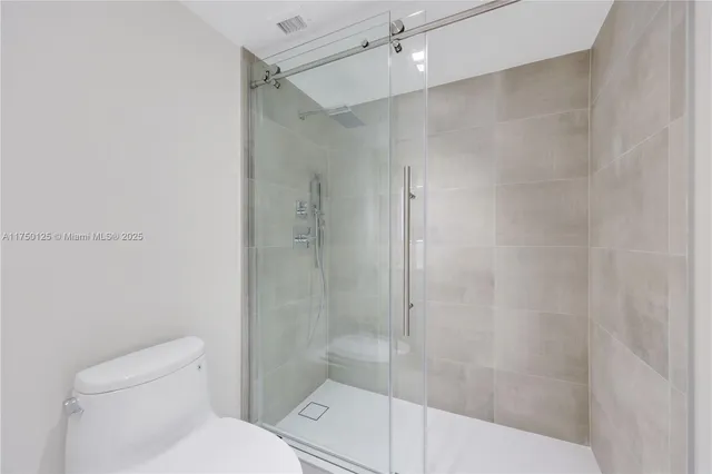 a view of a glass door with a view of the room