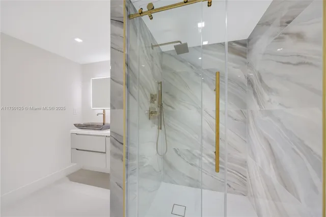 a white bath tub sitting in a bathroom