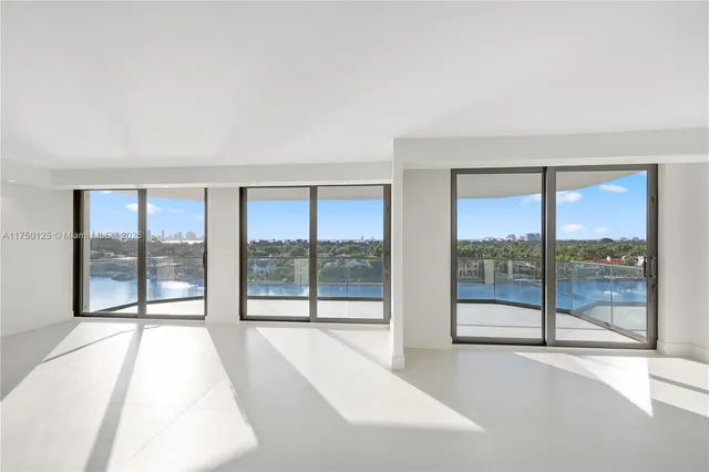 a view of empty room with floor to ceiling window