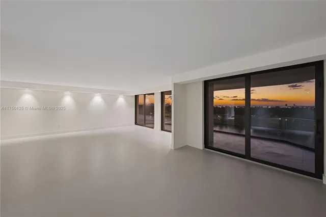 a view of a lake with houses in the back