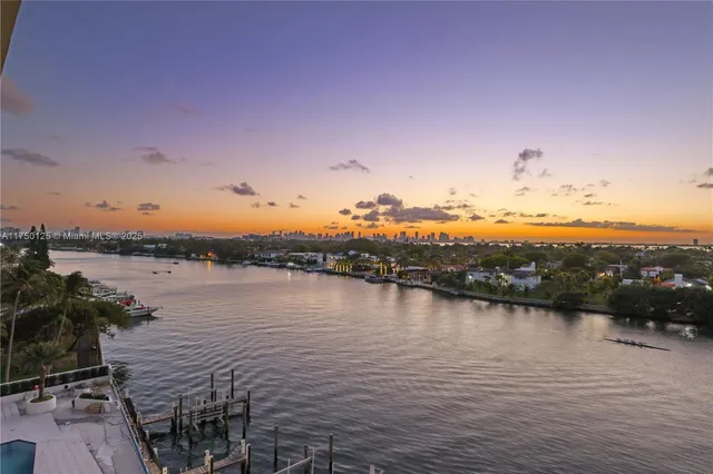 a view of lake with mountain in the background