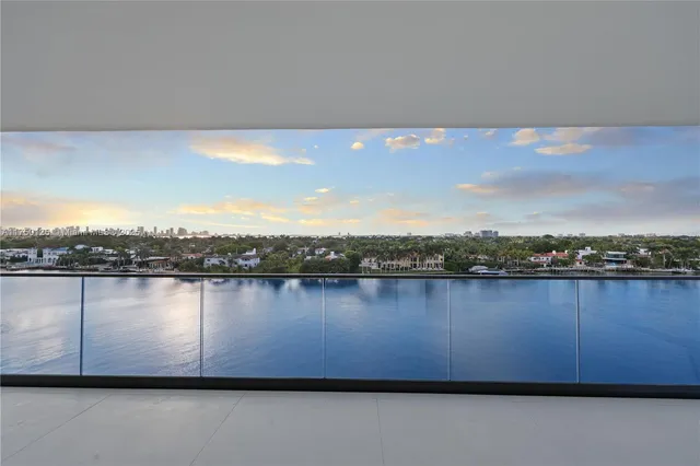 a view of a swimming pool with chairs