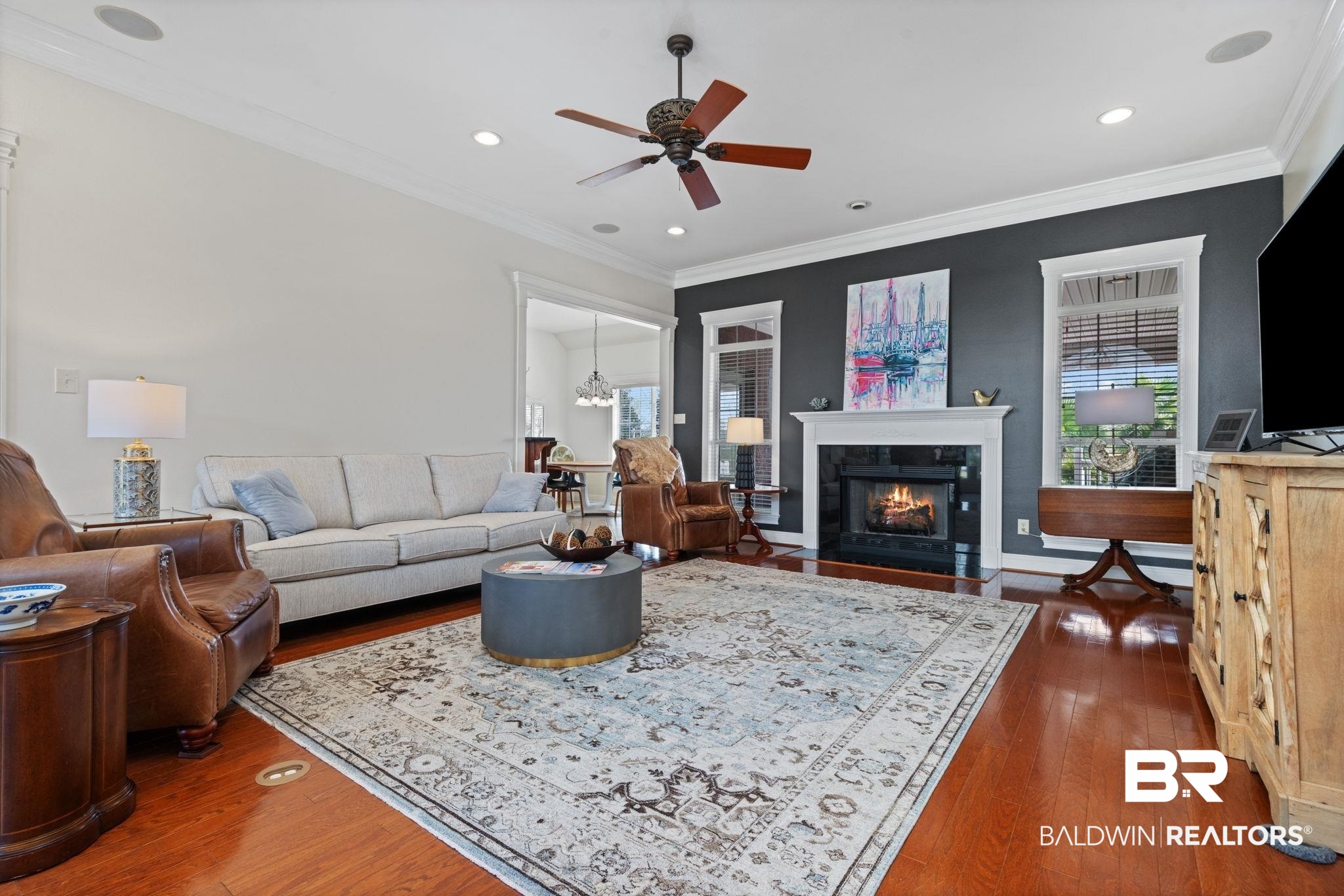 4771 Pecan Ridge East Mobile, AL 36619 - Photo 17 of 48 Living area with dark wood-style flooring, a fireplace, ornamental molding, ceiling fan, and recessed lighting
