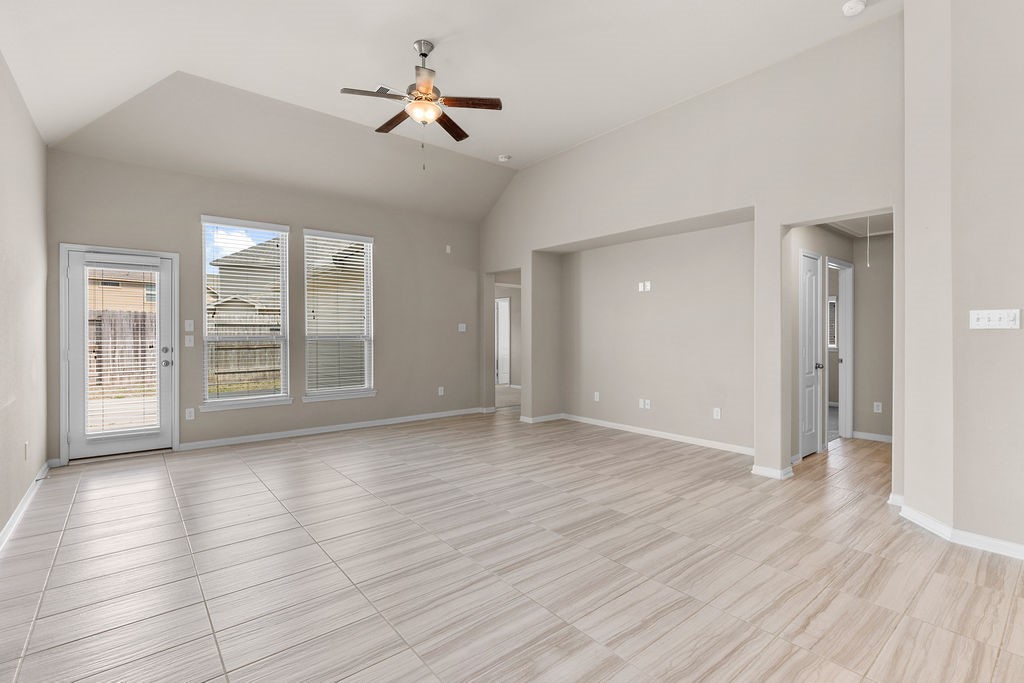 2666 Cedar Path Lane Conroe, TX 77385 - Photo 9 of 22 a view of an empty room with a window and wooden floor