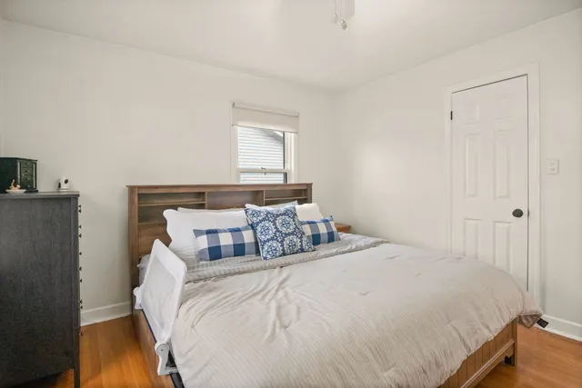 a bedroom with a bed and a tv