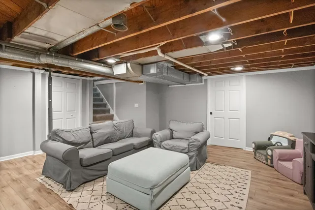 a living room with furniture and a rug