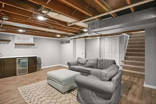 a balcony with furniture and wooden floor