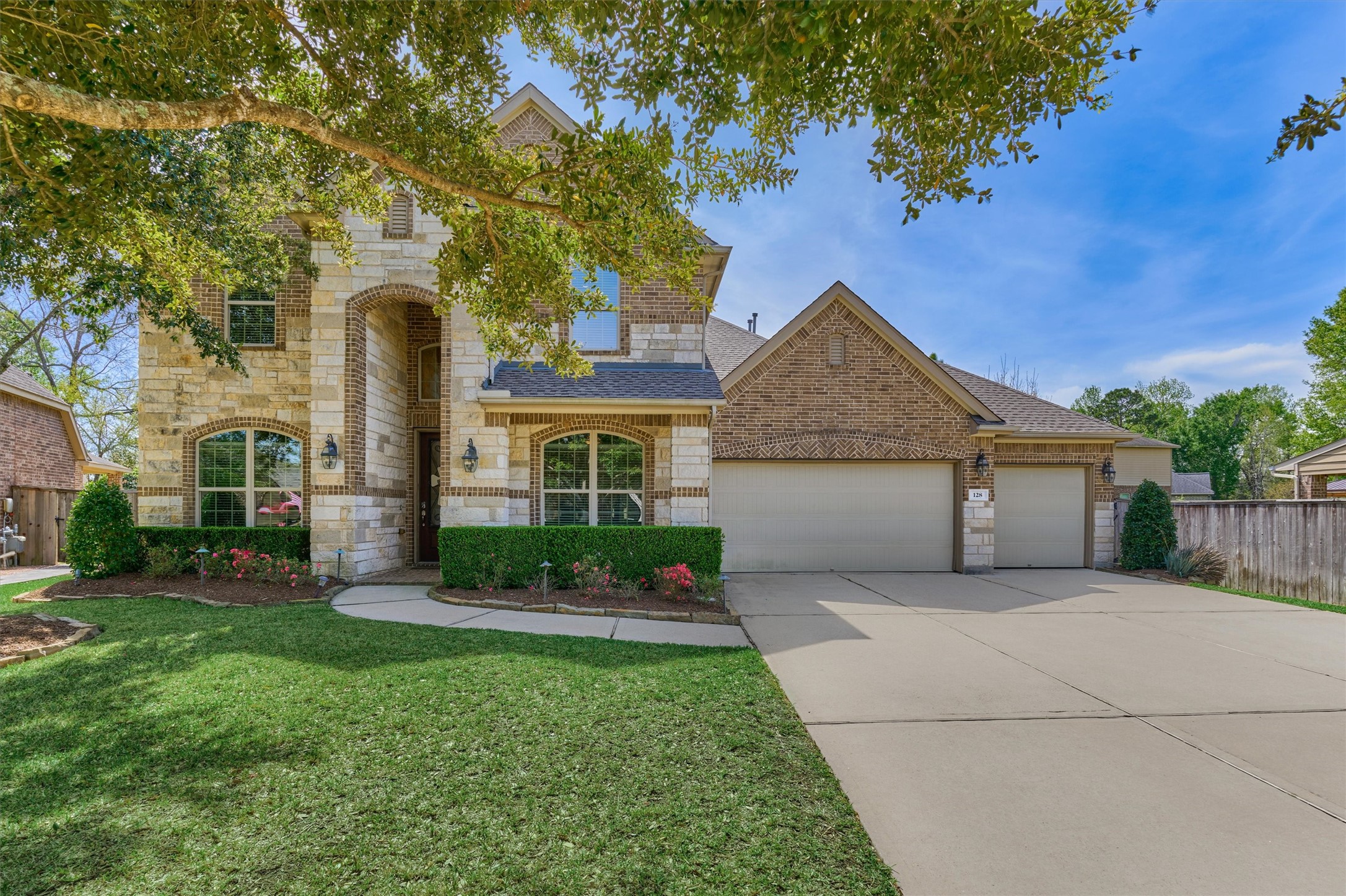 128 Shane Street Montgomery, TX 77316 - Photo 46 of 50 front view of a house with a yard and an trees