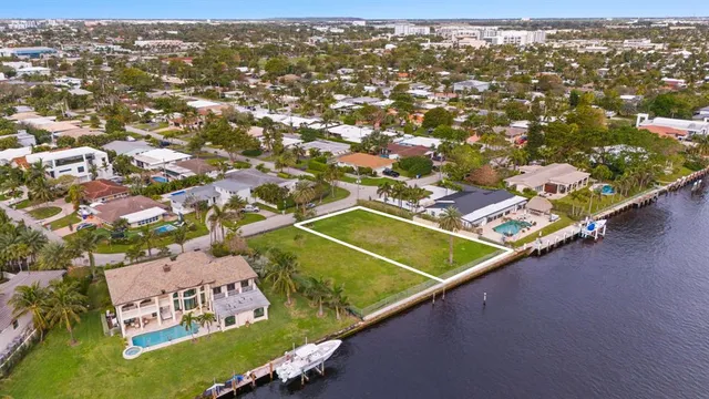 an aerial view of a tennis ground and a mountain view