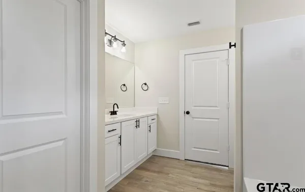 a view of a hallway with closet area
