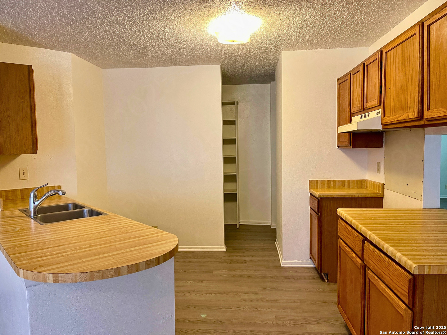 7315 Ridge Beach Drive Converse, TX 78109 - Photo 6 of 17 a bathroom with a granite countertop sink and a mirror