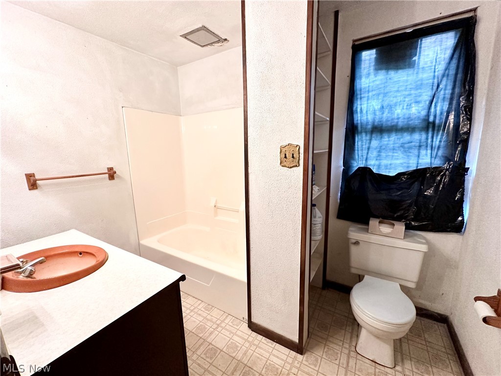 3235 Eldersville Road Colliers, WV 26035 - Photo 23 of 36 Full bathroom with washtub / shower combination, toilet, and vanity