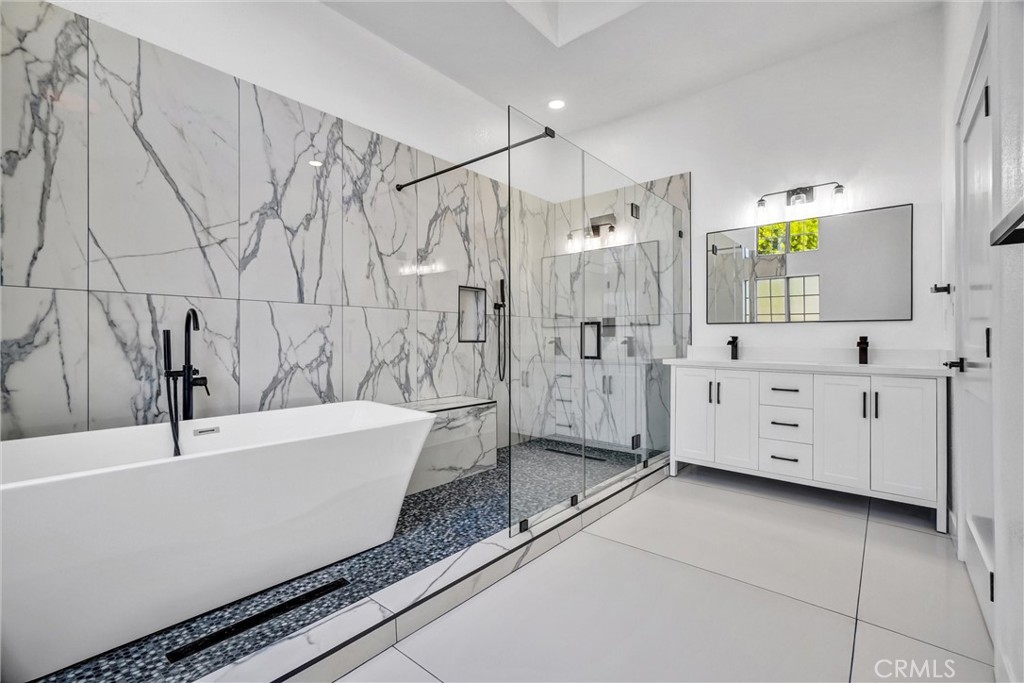 1200 South Castlegate Avenue Compton, CA 90221 - Photo 32 of 39 a bathroom with a bathtub and a shower