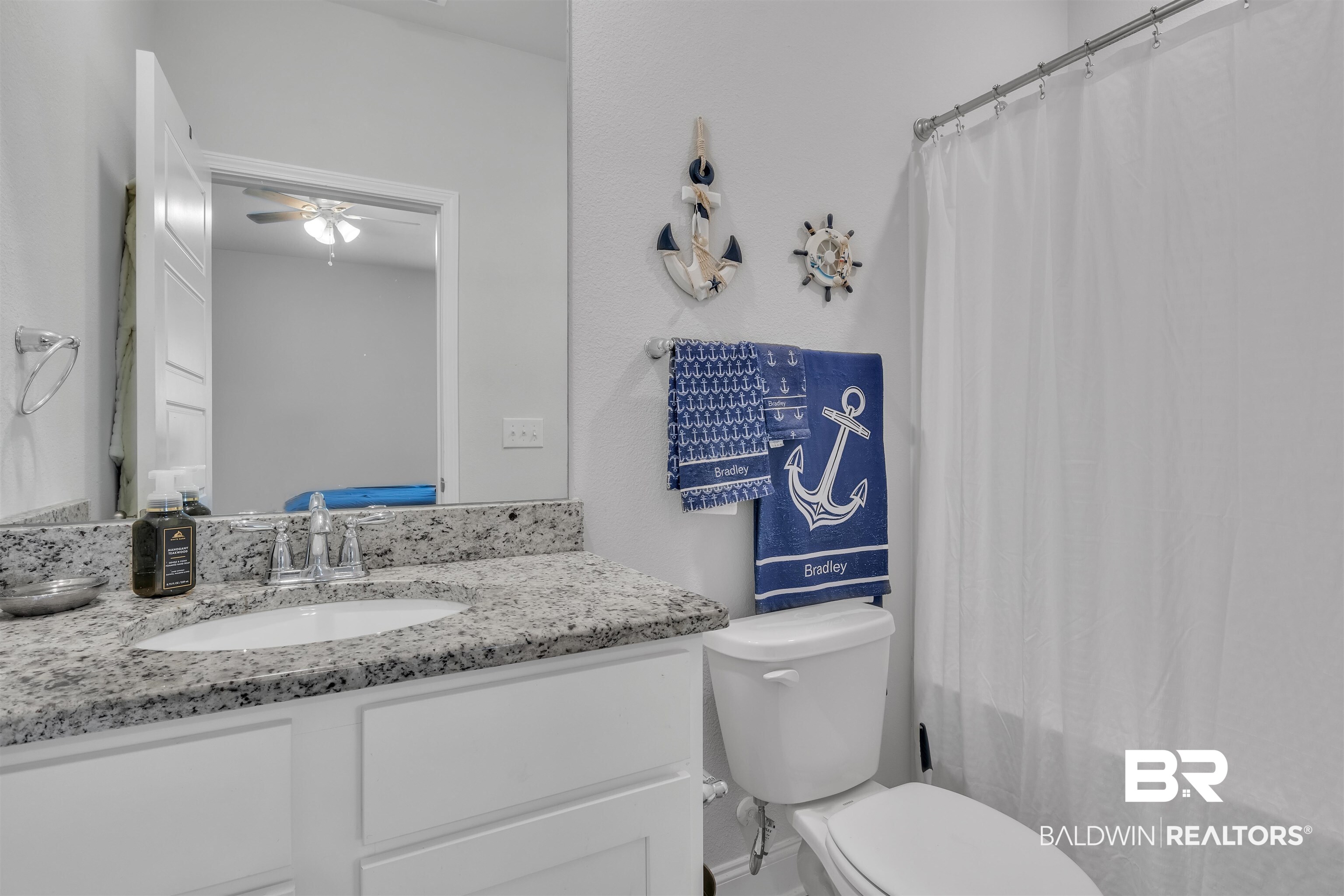 27862 Jade Court Daphne, AL 36526 - Photo 23 of 33 Bathroom with toilet, a ceiling fan, vanity, and curtained shower