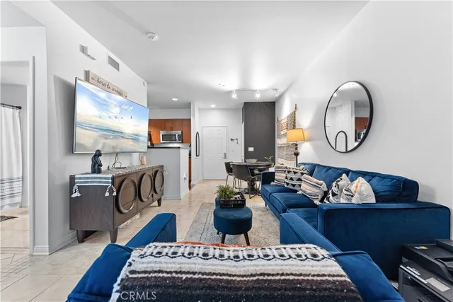 a bedroom with a bed and a night stand