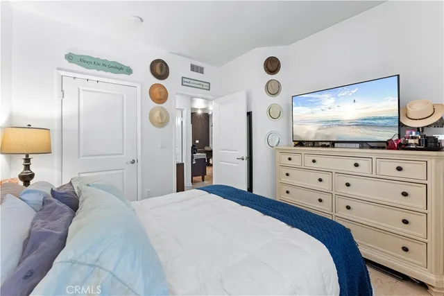a view of a patio with a table and chairs under an umbrella