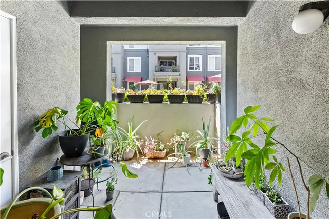 a view of a patio with swimming pool table and chairs