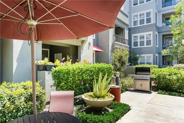 a living room with furniture a wooden floor and chandelier