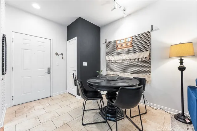 a kitchen with stainless steel appliances a sink and a refrigerator