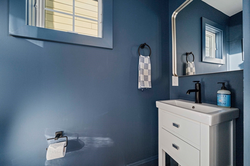 85 Glades Road Scituate, MA 02066 - Photo 11 of 42 a bathroom with a sink vanity and mirror
