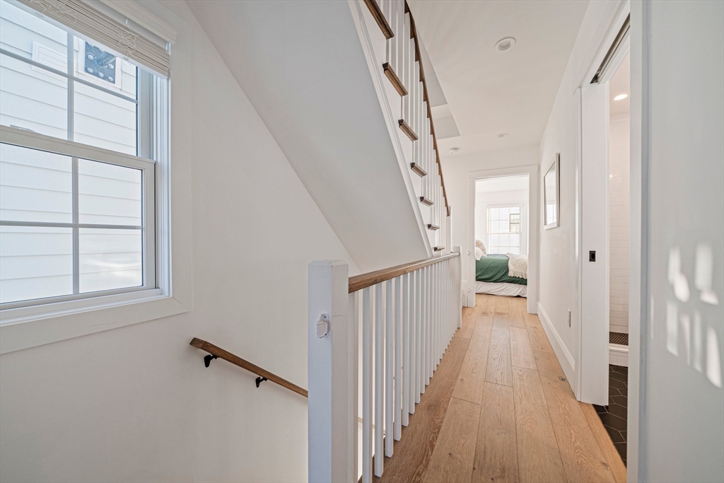 85 Glades Road Scituate, MA 02066 - Photo 14 of 42 a view of a hallway with a window