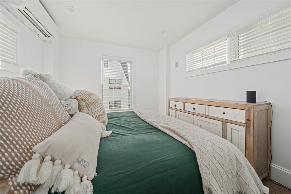 85 Glades Road Scituate, MA 02066 - Photo 16 of 42 a bedroom with a bed and a large mirror