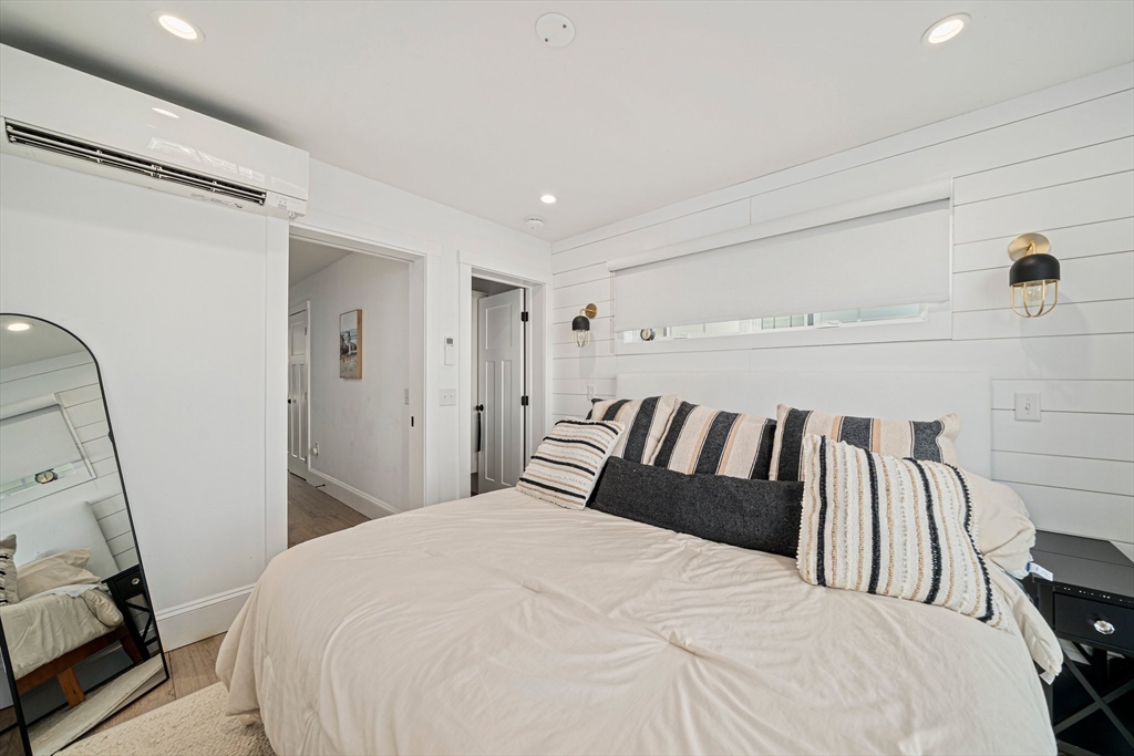 85 Glades Road Scituate, MA 02066 - Photo 19 of 42 a bedroom with a bed and walk in closet