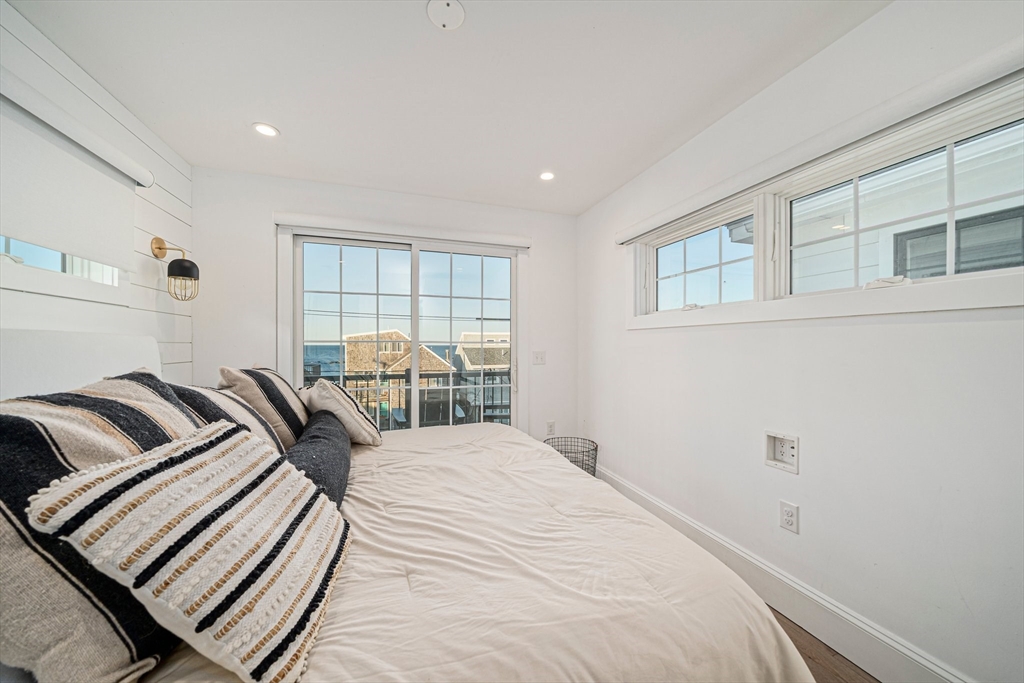 85 Glades Road Scituate, MA 02066 - Photo 20 of 42 a bedroom with a bed and wooden floor