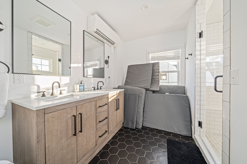 85 Glades Road Scituate, MA 02066 - Photo 24 of 42 a bathroom with a double vanity sink mirror and toilet