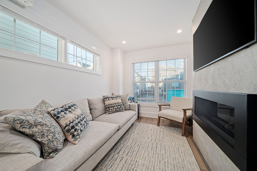 85 Glades Road Scituate, MA 02066 - Photo 4 of 42 a living room with furniture and a fireplace