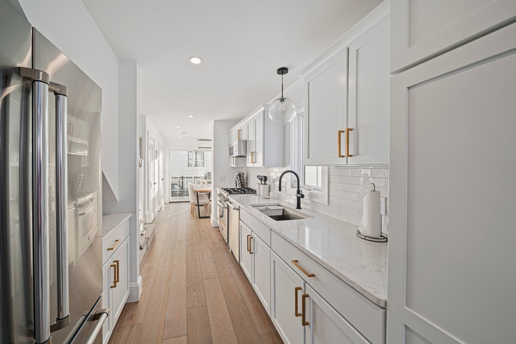 85 Glades Road Scituate, MA 02066 - Photo 8 of 42 a large white kitchen with a sink