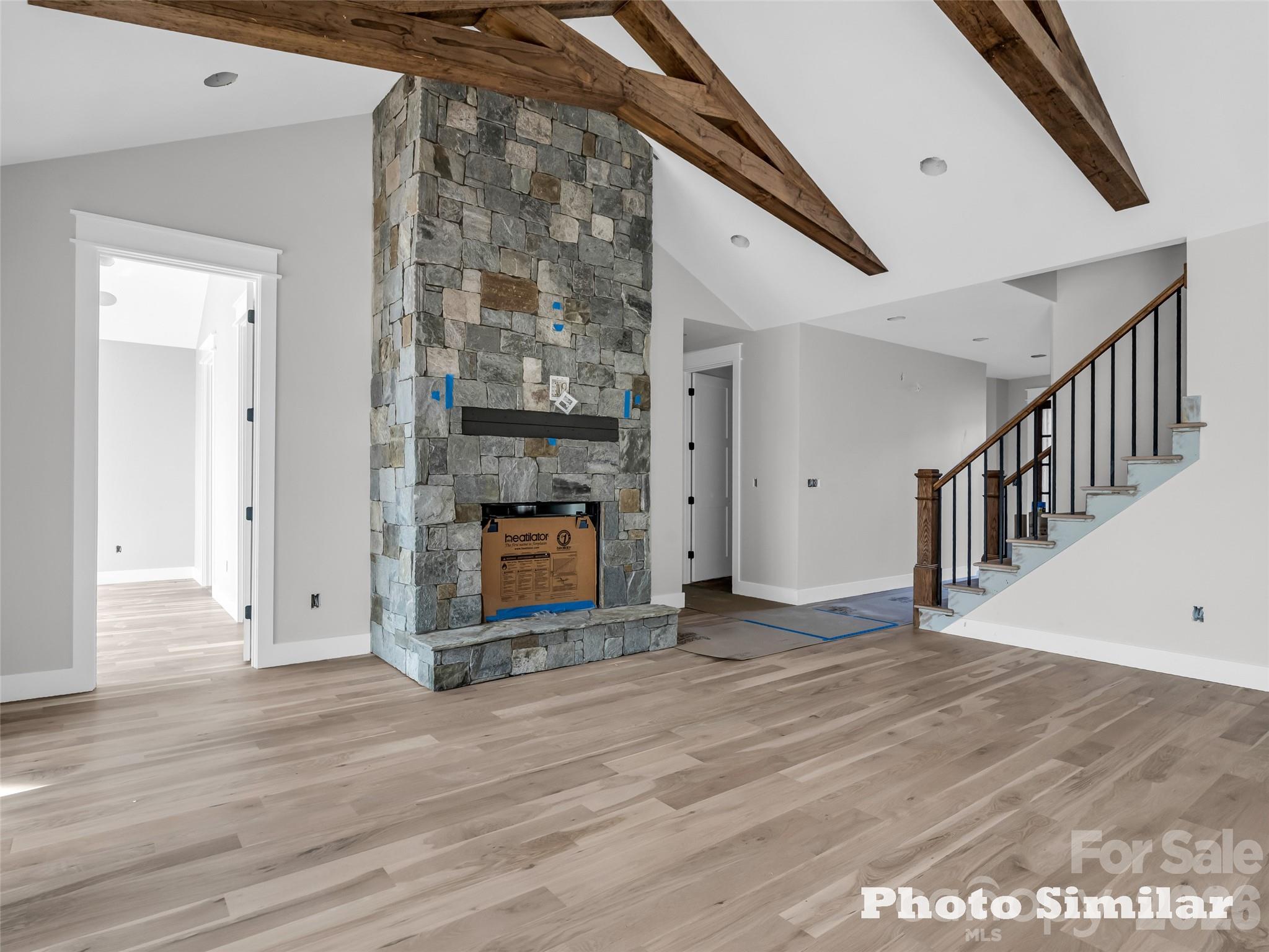 1 Jackson Ridge Ln Mill Spring Mill Spring, NC 28756 - Photo 11 of 43 a view of a livingroom with wooden floor and staircase