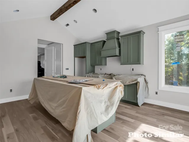 a living room with a bed furniture and a window