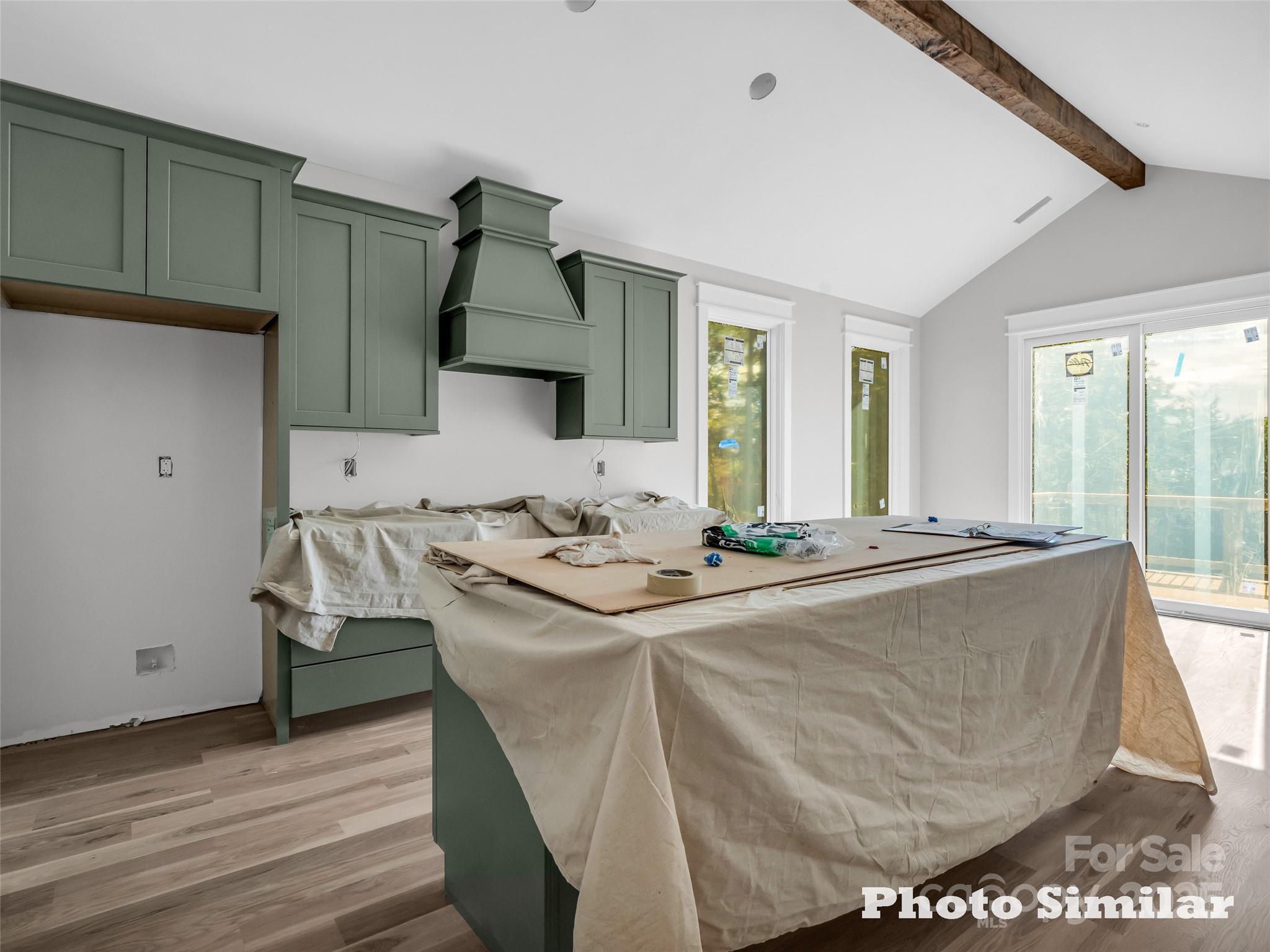 1 Jackson Ridge Ln Mill Spring Mill Spring, NC 28756 - Photo 13 of 36 a living room with a sink and a stove with wooden floor