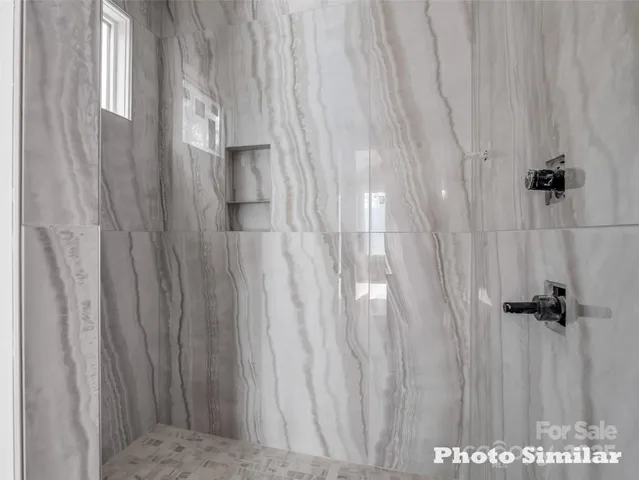 a view of a bathroom with shower