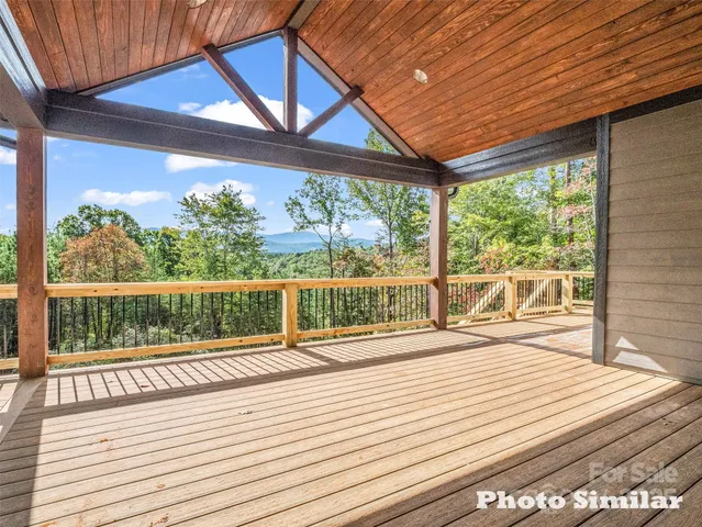 a view of a balcony with wooden floor
