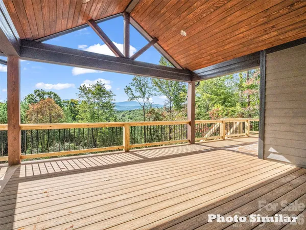 a view of a balcony with wooden floor