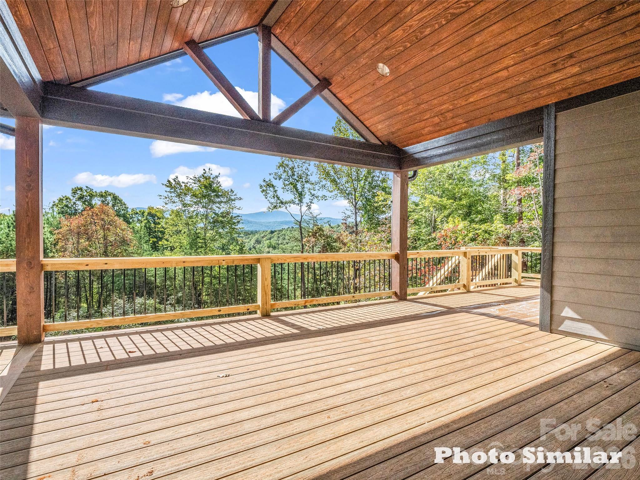 1 Jackson Ridge Ln Mill Spring Mill Spring, NC 28756 - Photo 32 of 43 a view of a balcony with wooden floor