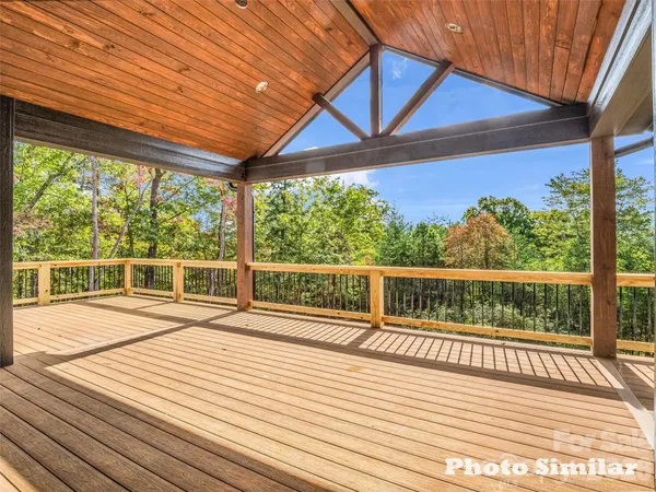 a view of a balcony with wooden floor